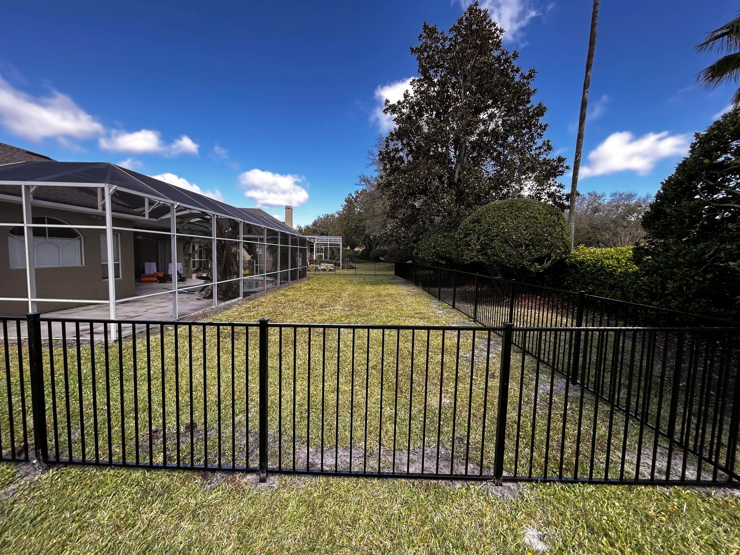 Fenced backyard with screened porch — British Heritage Fence 2024