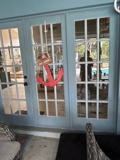 Blue French doors with red anchor Key Largo decoration — British Heritage painting project