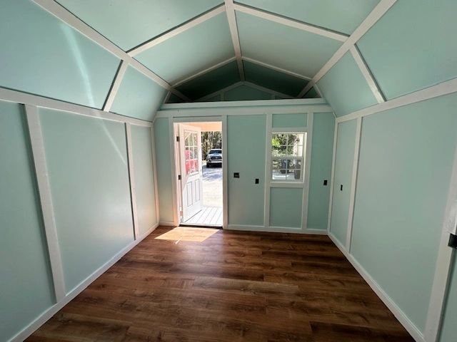 Mint green shed interior with dark wood floor — completed